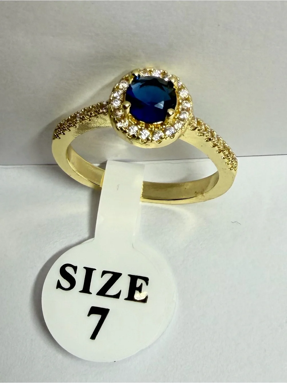 Gold Ring with Blue Center Stone and Halo Accent - Size 7